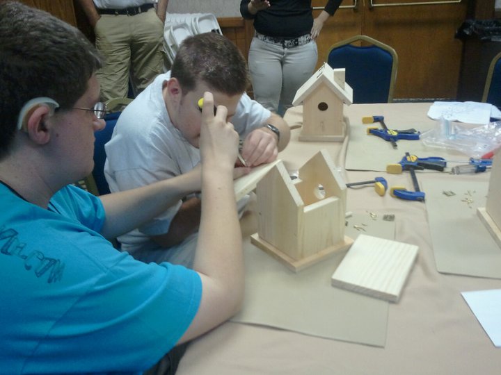Teens working on their Bird House crafts